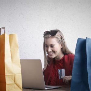 Happy woman shopping online at home